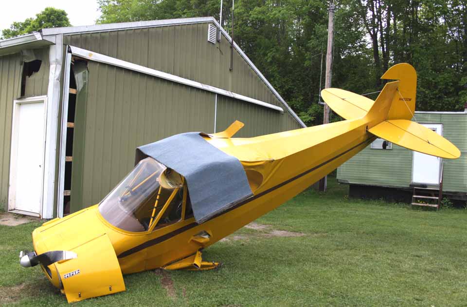 A single-engine Piper crashed into a shed owned by Bill Light across Route 166 from the Cooperstown/Westville Airport about 8 p.m. Monday.   The plane belonged to Frank Toth, the contractor.  There was a second person and a dog in the craft as well, Light said.  The plane, traveling from the northeast north of the airport, came over the tree line, hit the lawn next to 166, lost a wheel, then skidded toward the shed.  A wing struck the shed, slowing down the aircraft.  Light said neither Toth or the others appeared to be injured.  (Jim Kevlin/allotsego.com)