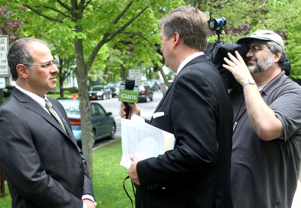 Cooperstown Mayor Jeff Katz, left, is interview by Greg Floyd and camera man Mark Zwinak in front of Village Hall this morning.  The usual casual Katz kidded:  "I wore a suit and tie so nobody would recognize me."  He is among the invitees at the President's speech this afternoon at the Hall of Fame.