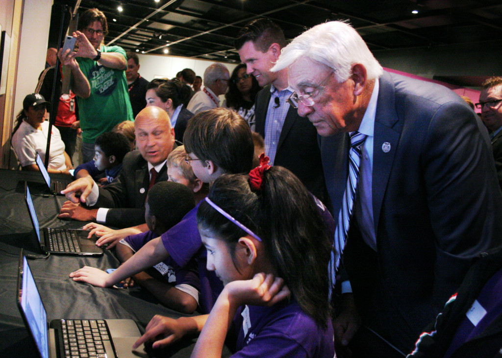 Youngsters from the New Scotland Elementary School in Albany work side by side with Cal Ripken, Jr. and Phil Niekro today at the Baseball Hall of Fame exploring the virtual tour of the museum now available on the Google Cultural Institute.  E-visitors can pass through the halls and zoom in on photos and displays with the click of a mouse. (Ian Austin/allotsego.com) 