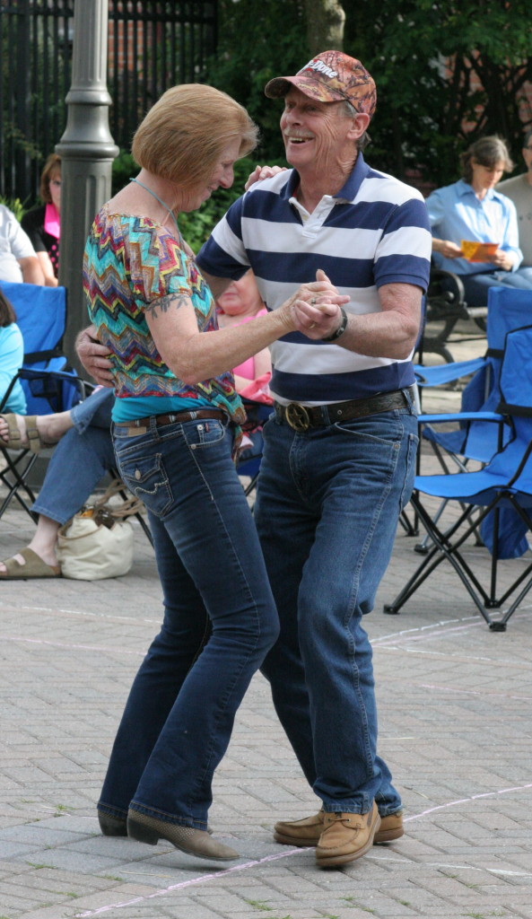 Joyce Milhalics and Jack Hand of Oneonta dance together to the sounds of the 50's sung by Tom Pondolfino and others  in Muller Plaza on Friday evening as part of the First Friday line-up. (Ian Austin/ allotsego.com)
