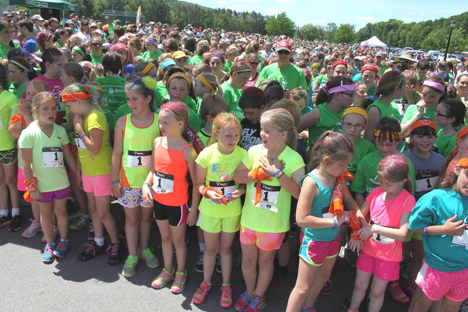 The Morris contingent, including Carissa Richards, 8, and Justine Morton, 9, in flourescent yellow T-shirts, were on the starting line at today's Girls on the Run 5K in Cooperstown.   More than 700 girls competed, plus 300 family and friends.  (Jim Kevlin/allotsego.com)