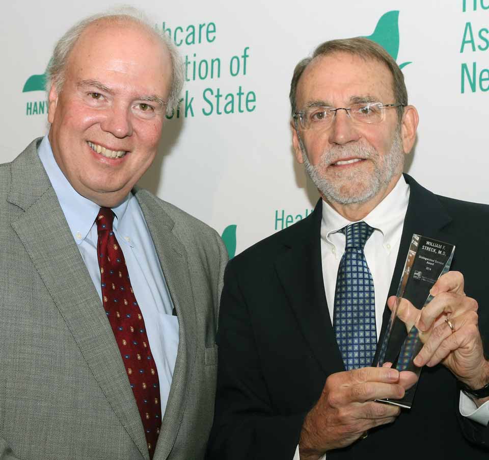 Dr. William F. Streck (right), CEO of Bassett Healthcare Network, accepts the Distinguished Service Award from HANYS president Dennis Whalen.  (Bassett photo)