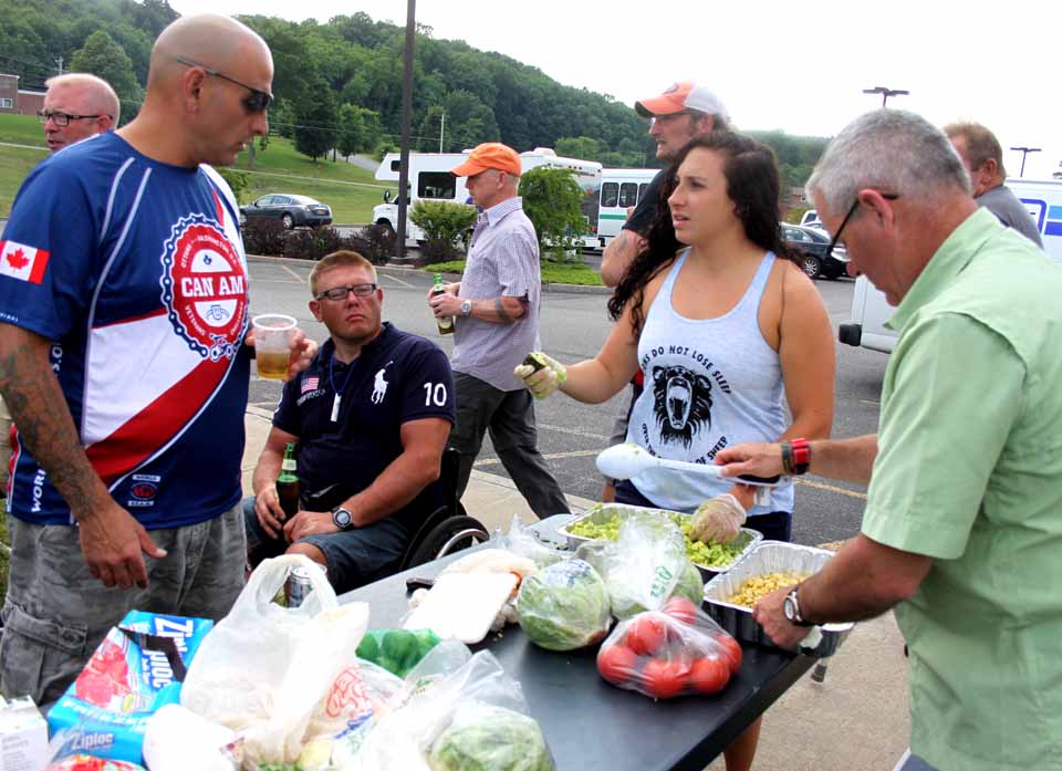 Partaking of barbecue this evening at the Holiday Inn Express, Hartwick Seminary, are, from left, Marc Gabiger, Boise, Idaho, a U.S. soldier; Jens Sondergaard, a Danish Army veteran from Viborg; Marine Courtney Hill from Los Angeles, and Canadian Air Force vet Dean Peach of Nova Scotia.  (Jim Kevlin/allotsego.com)