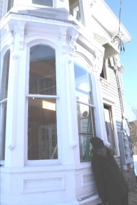Last March, Worcester Supervisor Diane Addesso peered through the window of the building next to the Weiting Building that is being renovated into a new library. (File photo/allotsego.com)