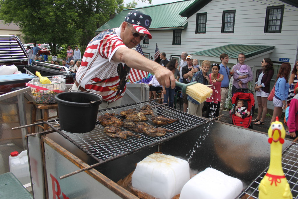 John Brooks, retired owner of Brooks BBQ, Oenonta, simulated a grill by splashing water on dry ice -- very nifty.  A highpoint of the Springfield parade was a Brooks feast the followed at the community center.