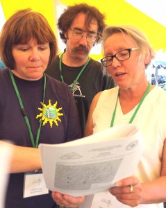 OCCA President Vicky Lentz, right, reviews the water quality report with OCCA Director Darla Youngs, left, and Jeff O'Handley, program director.