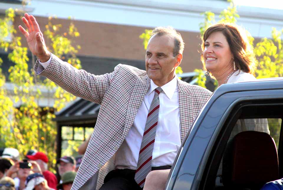 Retired Yankees manager Joe Torre, with wife Ali, was hailed by adoring throngs, eight ranks deep on both sides of Cooperstown's Main Street. He rode in the final Ford pickup in the Legends of Baseball Parade, which ended a few minutes ago. At 1:30 p.m. Sunday, he will be inducted into the Baseball Hall of Fame with five other heroes of the game. (Jim Kevlin/allotsego.com)