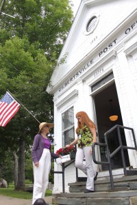 Postermaster Victoria Bonner, right, chats with Village Historian Leigh Eckmair recently outside the historic Gilbertsville post office.  (Jim Kevlin/allotsego.com)