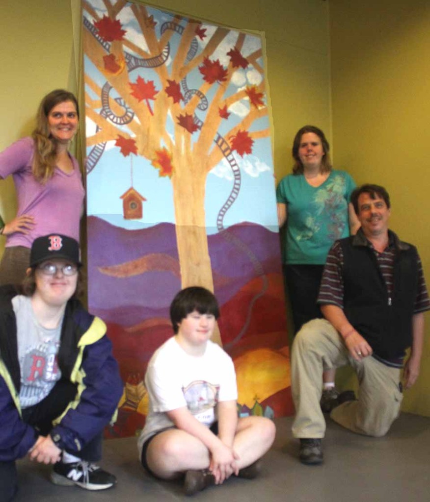 Artists from Arc Otsego's Main View Gallery installed a mural on the lower level of the walkway to the parking deck in downtown Oneonta today. Clockwise from upper left are Karin Bremer, Linda McCord, Katie Sullivan Vincent Devine and Maria Brockmann. (Jim Kevlin(allotsego.com)