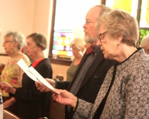 The Rt. Rev. Mark Sisk, retired Episcopal bishop of New York, and wife Karen join in the recessional hymn.  The Sisks retired to Jefferson, Delaware County, in 2013.