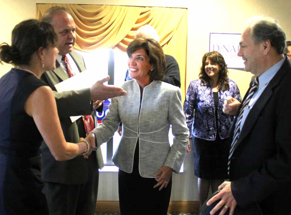 Kathy Hochul, Governor Cuomo's runningmate for lieutenant governor, is in Otsego County this evening for the annual Jedediah Peck Dinner at the Country Inn & Suites  in Hartwick Seminary.  Here, county Chairman Richard Abbate introduces the candidate to former Oneonta Mayor John Nader, at left is Kim Muller, Nader's predecessor.  Congressional candiidate Sean Eldridge was also in attendance, and state Controller Tom DiNapoli was due to deliver the keynote.  The guest of honor was Bill Streck, retired Bassett Healthcare president/CEO and a prominent local Democrat.  (Jim Kevlin/allotsego.com)