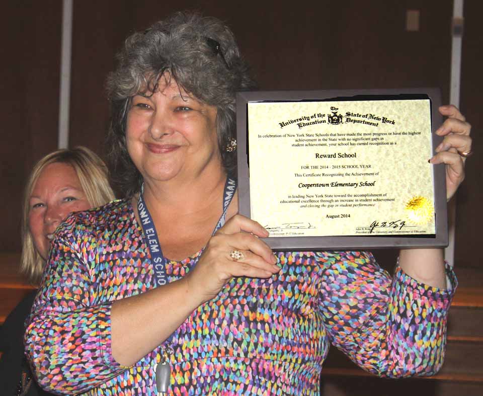 Cooperstown Elementary Principal Teresa Gorman received a certificate this morning recognizing her school as one of 250 "Reward Schools" in the state, the best out of 4,500 schools statewide. Executive Principal Lynne Strang made the presentation during the opening assembly for faculty and staff. Details in this week's Freeman's Journal. (Jim Kevlin/allotsego.com)