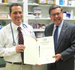 :   Senator James L. Seward (right) presents a pen certificate from the governor to Dr. David Leahy of Community Veterinary Center in Oneonta commemorating the signing of senate bill 2742B into law. 