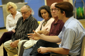 L-R: Laura Dohner, Frank Omara, Cecelia Zapata and Keith Bachman listen to Kaler Carpenter,  who, as the leader of the Redemption Movement, routinely serves students with free rides home from bars and welcome baskets when they move into the neighborhood
