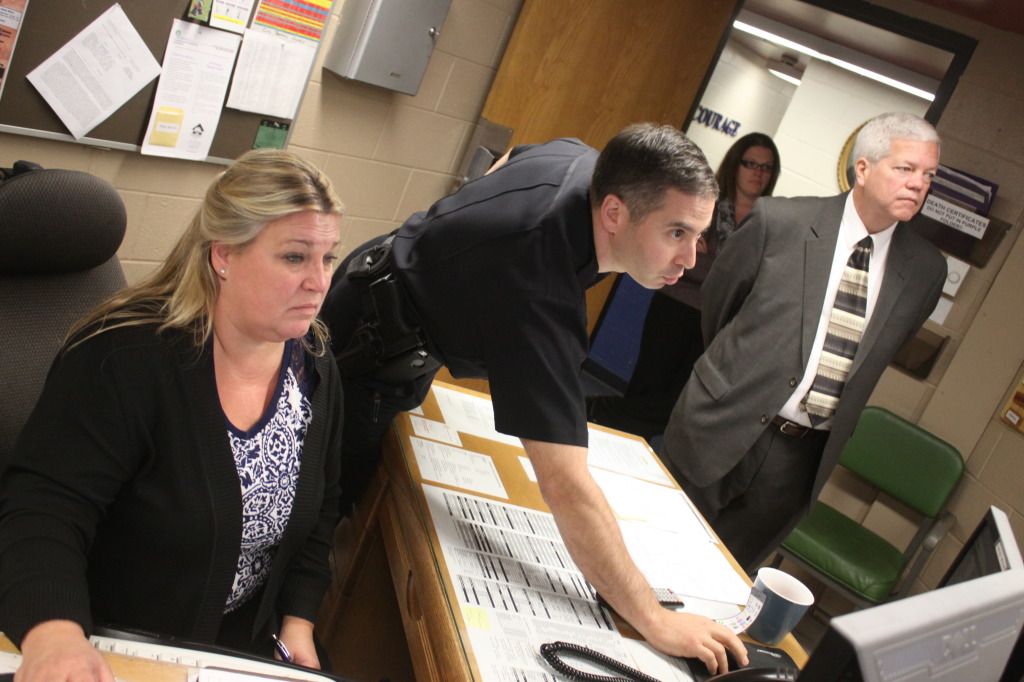 Today marked the first day on the job for Marty Murphy, Oneonta's new City Manager, who began by touring many of the city's departments and meeting their staff. During his tour of the Police Station Chief Dennis Nayor, center, demonstrates the number of features of the city's surveillance cameras to Murphy. They are joined by Meg Hungerford, rear, and Senior Dispatch officer Lisa Prush, left. (Ian Austin/allotsego.com)