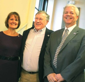 The mood was brighter earlier in the evening, when the mayor swore in the new city manager in City Hall's foyer. At left is Marty Murphy wife Penny.