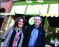 Jim Havener poses with Michele Barry in front of the Green Toad after signing papers to acquire the downtown mainstay. (Ian Austin/HOMETOWN ONEONTA)