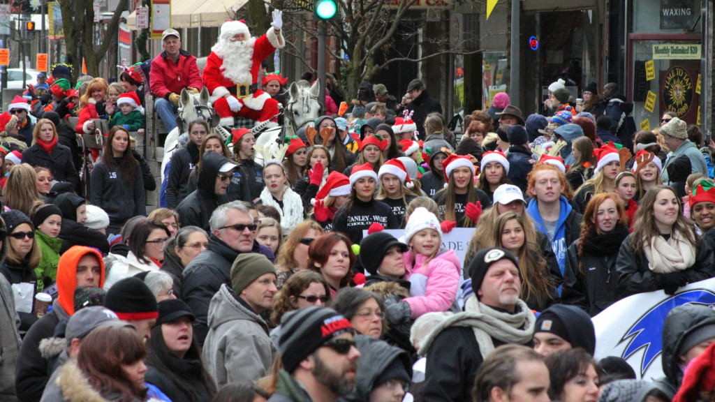 The weather was absolutely perfect for the Santa Parade in Oneonta on Saturday that drew a record number of spectators to see dancers, music, floats, puppets and the Jolly Elf himself, seen here headed up Main st in his horse drawn wagon. (Ian Austin/allotsego.com)