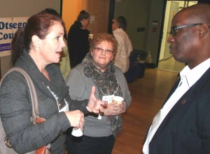 Julia Goff, Destination Oneonta (formerly MSO) director, discusses the challenges a newcomer can face with Mark Vaugh of Corning Inc., keynoter at today's Inclusivity Summit.  Lynne Sessons of ARC Otsego listens.