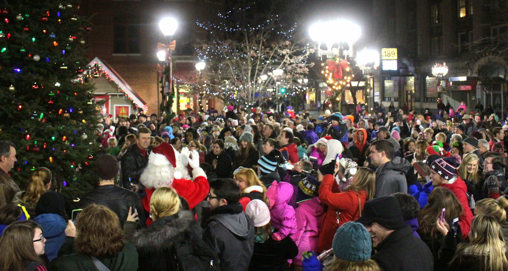 With the help of the crowd, Acting Mayor Russ Southard and Santa Claus light the Christmas tree in Muller Plaza on Thursday night.