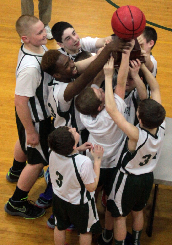 The victorious Clark Sport Center Boys basketball team, who, under the direction of coach Sharkey Nagelschmidt,  won the 11th annual Patrick Fetterman Memorial Basketball Tournament with a score of 44-23 against St. Johnsville. on MOnday afternoon.