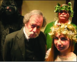 Ebenezer Scrooge (Oneonta’s Gary Koutnik) is surrounded by his ghosts – from right, Christmas Past (Caley Sharratt), Christmas Present (Gary Kuch) and Christmas Yet To Come (Art Newell). (Jim Kevin/The Freeman's Journal)