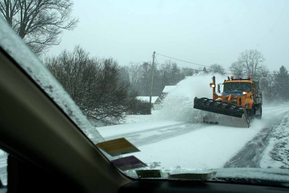 The plows were out this afternoon, including this one on Route 28 near Milford Center, but rains were expected to wash the snows away Sunday in Cooperstown and Oneonta as temperatures reached 48.  But watch out:  more snow possible Sunday night.  (Jim Kevlin/allotsego.com)