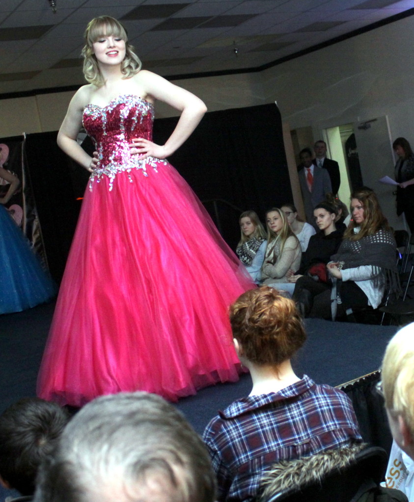 Oneontas' Hannah Harby, a SUNY freshman, models some of the newest prom fashions at the 4th annual Prom-a-Palooza at the Southside Mall on Sunday. 