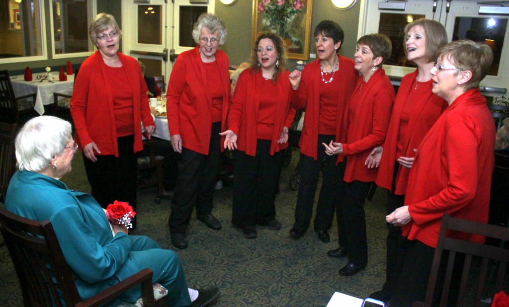 Inge Roemer, left, a resident at The Plains at Parrish Homestead received a Valentine's Day serenade from the Sweet Adelines, courtesy of her children Bette and Bob Bennet. Singers are Cindy Heaney, Pat Ashe, Jennifer Withington, Terry Hait, Sue Dana-LeViness, Joanne Burdick and Elaine Mattice.