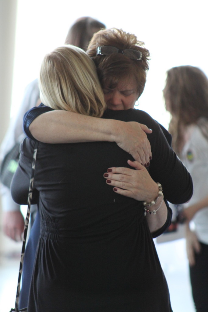 Bon Zuefle, mother of Tiffanne Wells, embraces Suzanne Brown, a friend of the family for 40 years at the memorial service held Friday, March 13 at Foothills.  Over 300 people turned out to share memories of Tiffanne, who died Saturday, March 7.