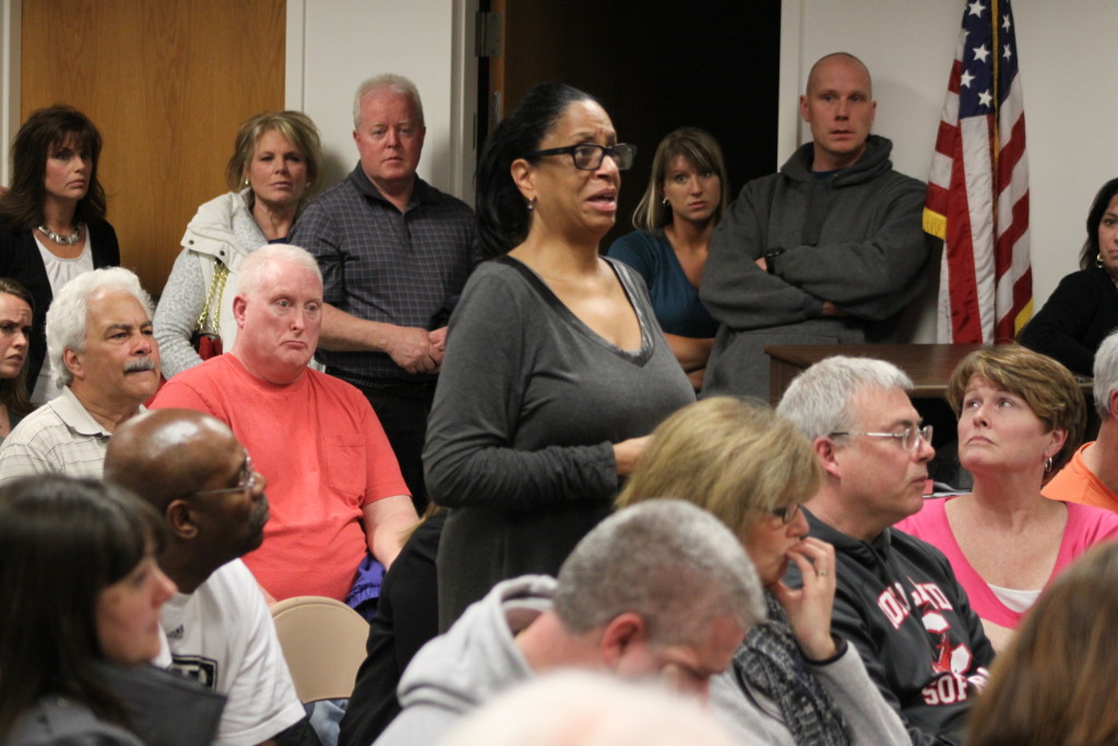 Oneonta Town Hall was filled with Town of Oneonta residents on Monday night voicing their concerns on the proposed Hemlock Adult Community on County Highway 47. Here, Donna Johnson, who lives across the street from the proposed building sight, expresses worry that the land owner of sites around her including this proposed site, have been lax on their upkeep. (Ian Austin/allotsego.com)
