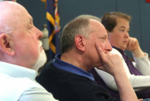 Planning Board chair Gene Berman listens intently to architect Teresa Drerup's presentation.  He is flanked by Paul Kuhn, left, and Planning Board clerk Jennifer Truax.