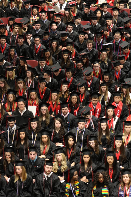 Graduates of the class of 2015 stand and prepare to be recognized as newly minted SUNY Alumni at the Commencement Ceremony at the FIeld House on Saturday morning. (Ian Austin/ allotsego.com)