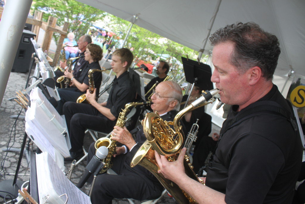 During Cooperstown's Spring Fling on Railroad Ave, the brass band kept the mood lively with their renditions of jazz standards. From right: Milo Stewart, Jr., Ed Bagley, Sean Mebust, Karen Dunlap and Arnie Junkind.  (Ian Austin/allotsego.com)