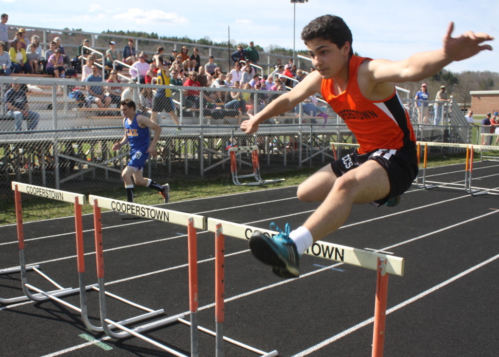 Teams from across the region competed in the Doc Howard Track Invitational at Cooperstown School on Saturday. Here is Cooperstown's Donnie Abate making short work of the hurdles. (Ian Austin/allotsego.com)