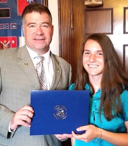 Congressman Gibson present the certificate to Hannah Sell in his office last Wednesday.