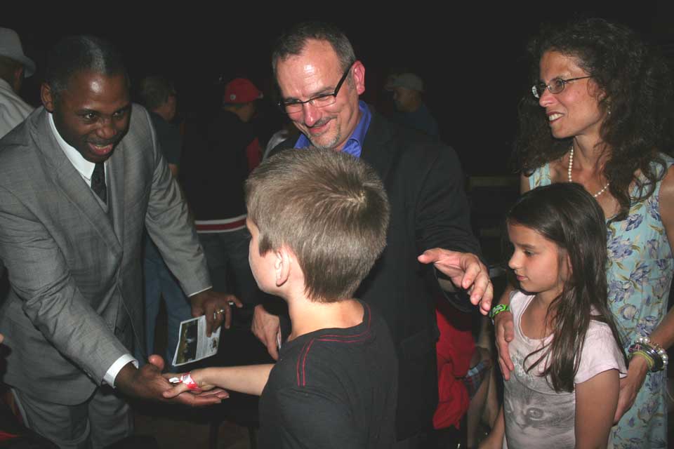 Marvis Frazier, now an ordained pastor, says hi to Oneonta's Dillon family during tonight's event. Dad Steve Dillon, the well-known local actor, narrated the "Meet Marvis" audiobook along with Reggie Bruson. Dillon's son Colin shakes the former Golden Gloves champ's hand. At left are his mom Lydia and sister Adriana.