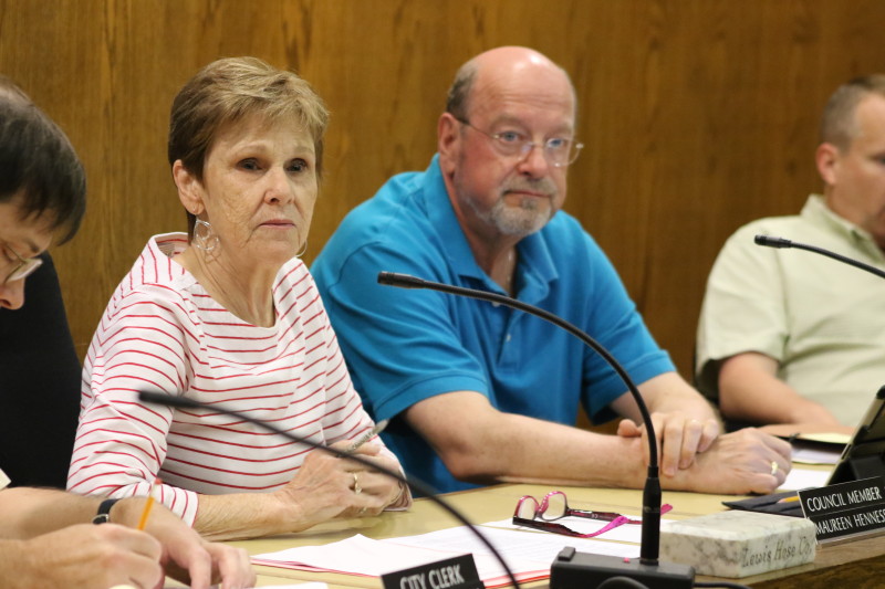 Acting Mayor Maureen Hennessey, seated next to City Attorney David Merzig, agreed to sign a severance agreement for former city manager Martin Murphy . (Ian Austin/ allotsego.com)