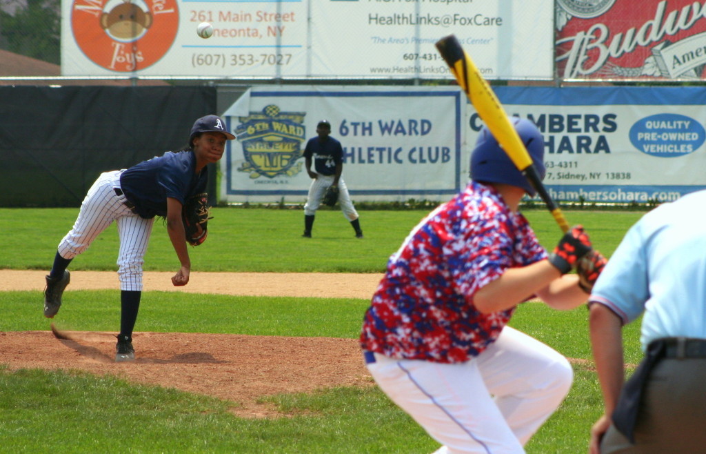 TJ Snyder, right, of the Oneonta Hurricanes, goes to bat against rising star Mo'ne Davis and the Anderson Monarchs during their game at Damaschke Field on Sunday afternoon. (Ian Austin/allotsego.com)