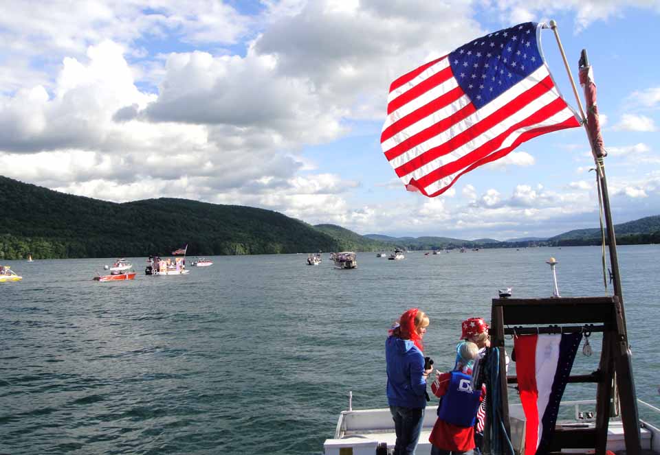 The Otsego Lake Association's webmaster Tim Pokorny sent along images of the OLA's second annual Fourth of July Boat Parade, which sailed from Three Mile Point last evening, passed Cooperstown's Lake Front Park, then went back to its beginning.  Tim also sent a link to more photos.