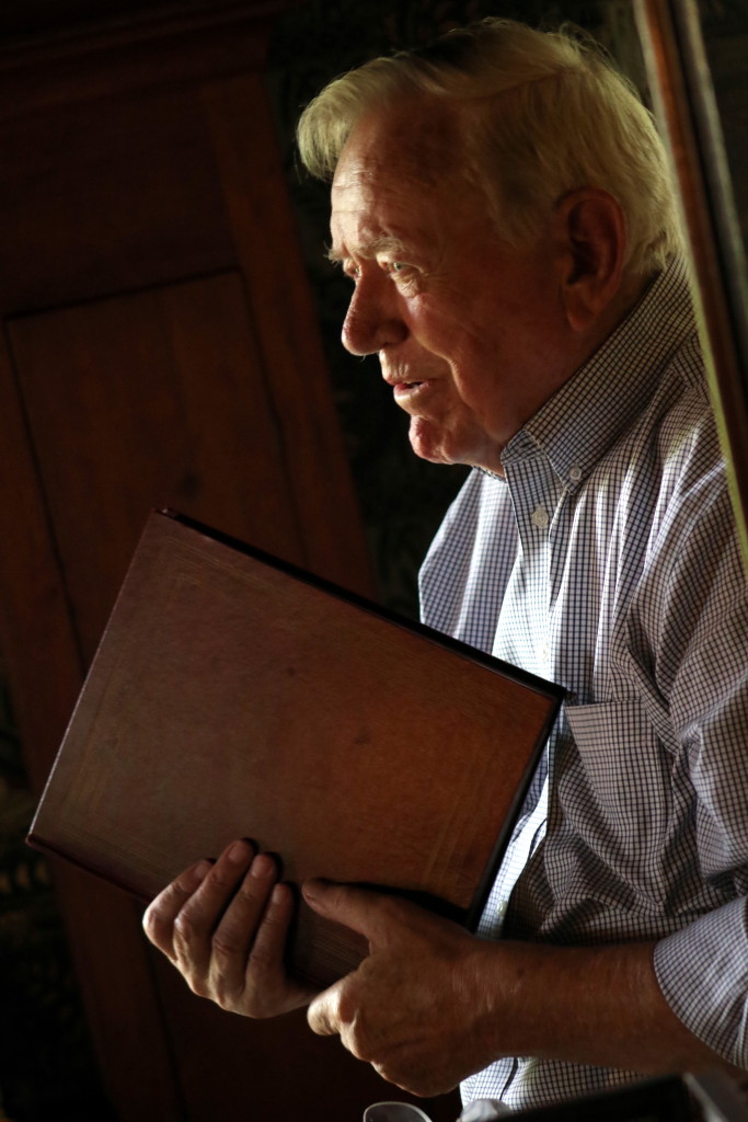 Former Mayor David Brenner was reading correspondence selections from his new book selections from his book The Life and Letters of Christopher F. Kompare U.S.N at the Swart Wilcox house as the last of their Summer Sunday series of talks and readings. In his hands he holds a folio of the original postcards that were collected and organized by Kompare's sister in the 1940's. (Ian Austin/ allotsego.com)