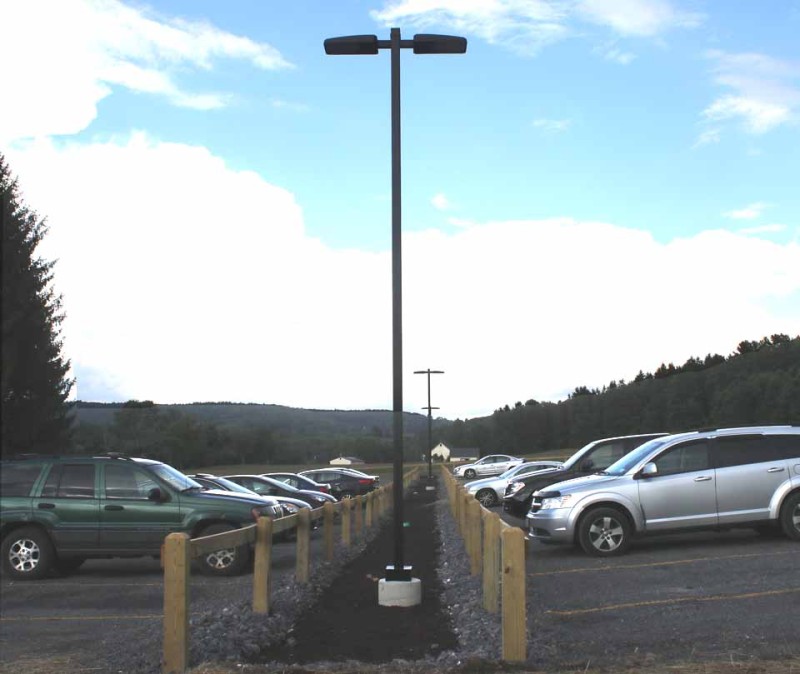Bassett Hospital's new parking lot across Route 33 from Iroquois Farm is completed and in use. Cars displaced from by the Clark Sports Center expansion were being parking at Glimmerglass State Park, nine miles north of the village, until the new parking lot was complete. (allotsego.com photo)