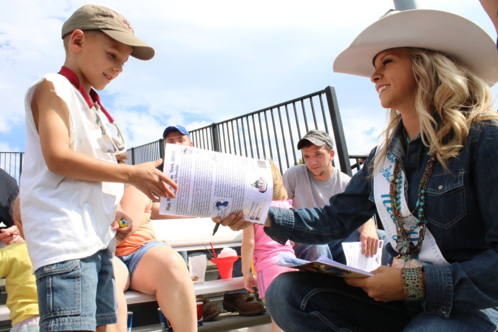 When she wasn’t competing in the cattle herding or barrel racing, Miss NY Rodeo Cheyenne Shufelt was signing autographs for fans in the stands like Ethan Temming, Oneonta. (Ian Austin/AllOTSEGO.com)