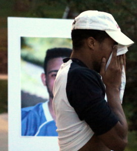 Travis Samuels pauses to wipe away tears as he shares memories of his former roommate, teammate and friend Dante Crump. (Ian Austin/allotsego.com)