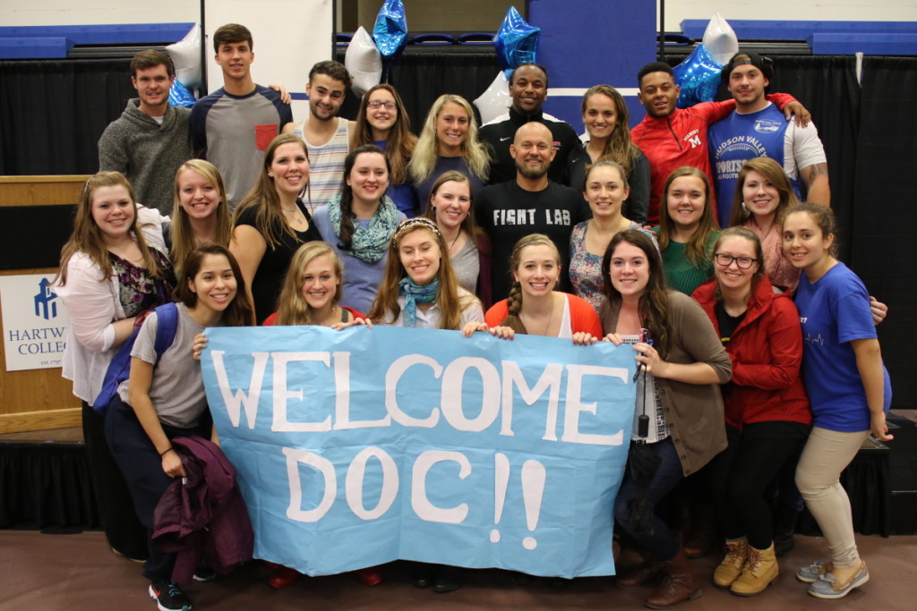 Peer leaders for Wick 101 pose with author Doc Hendley, whose book " Wine to Water", was this year's common read book. Hendley spoke to gathered students about the drilling of wells in third world nations and its impact on hundreds of thousands of people. The movement has spawned 11 chapters nationally, the largest being at Hartwick with 80 members. Front row: Paola Espinoza, Ann Cannon, Cosima Compton, Rachael Stethers, Cady Kuebler, Gina DeVoto, Krystina Rivera. Middle Row: Emily Weite, Alicia Clapper, Kara Connelly, Becca Krowitz, Doc Hendley, Sarah Fairbairn, Amanda Robinson, Shayanne DeBaker. Top row: John Talbot, Jacob Sinicki, James Canal, Kiana Bringham, Allie Ricci, Melijah Purvis, Maddy Paul, Justin Hoskins, Nicholas Celestino.