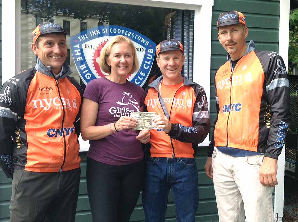 The CNYC/NYCM Insurance bicycle team donates it $250 winnings from the Cazenovia Hillbender rase in Chittenango Falls to the local Girls On The Run program. The bicyclists, from left, are Ben Savoie, Marc Kingsley and David Bertram. Accepting for GOTR is Sally Trosset. Team members not pictured are Abraham Benghiat and Steven Gates. In addition to winning the Hillbender overall, Bertram won overall third, plus first in his age groupd; Kingsley was 14th and third, Gates was 12th and third, and Savoie was 22nd overall. The Hillbender is a benefit for the Two Smiles, One Hope effort.