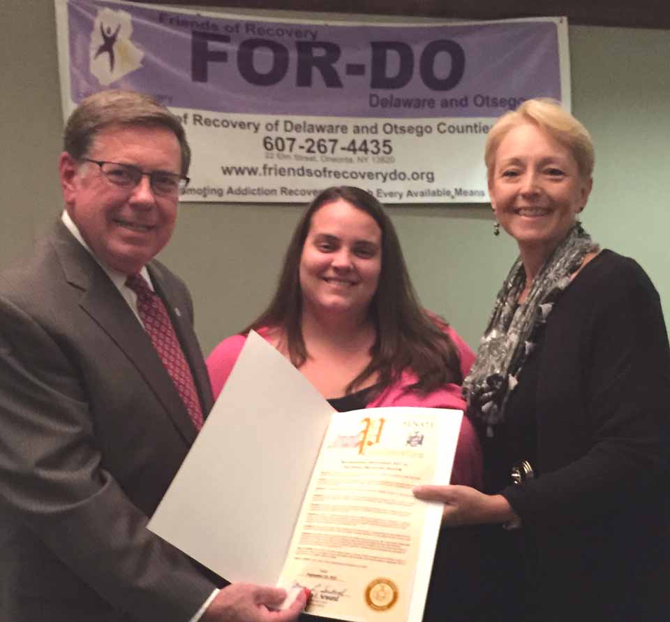 State Sen. Jim Seward, R-Milford, presents Julie Dostal, LEAF executive director LEAF and Jeanette Tolson, executive Director FOR-DO with a proclamation recognizing September 2015 as National Recovery Month at the annual recovery dinner in Oneonta.