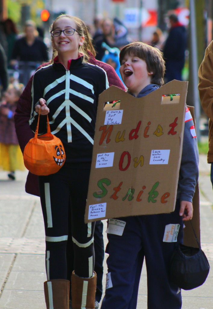 A Skeleton (Hannah Ashe) and a nudist on strike (brother Noah Ashe, Oneonta) enjoying themselves at Oneonta's downtown Trick-or-Treating.