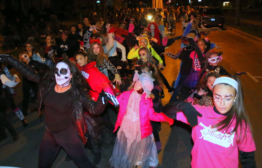 Gillian Skidmore, Peneolope Wilson and Michelle Geasy lead the dancers of Gillian's Dance Arts in their rendition of Michael Jackson's "Thriller" in tonight;s Halloween Parade in Oneonta.