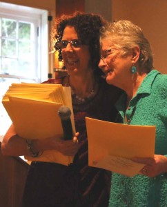 Honoree Grace Smith is hugged by artist Janet Wentworth Erickson during this evening's ceremony.
